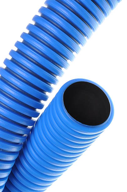 Blue corrugated pipe for electrical high-voltage cables Blue corrugated pipe for electrical high-voltage cables isolated on white background rustproof stock pictures, royalty-free photos & images