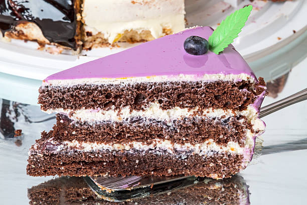 istock Piece of blueberry cake on the mirror surface 506400954