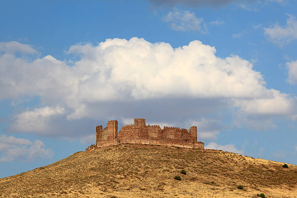 Castilla la Mancha, Spain - June 25, 2014: Almonacid castle ruin on top of a mountain in Castilla-La Mancha, Spain
