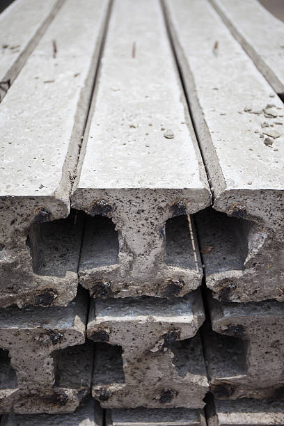 istock Side view of concrete electric pole piles preparing for construc 506402567