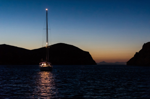 Night photo of sailing boat at anchor. Isle de Cabrera, Spain