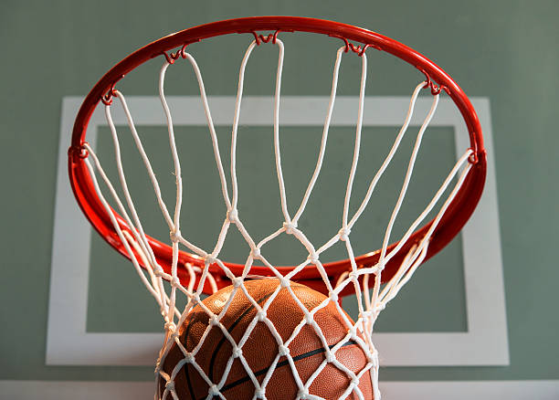 istock Basketball goal with ball and net 506403265