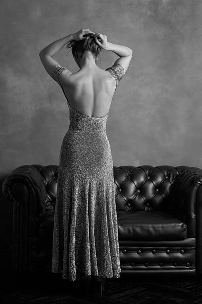 istock Woman in evening dress with open back 506403624