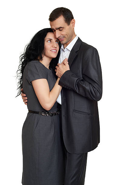 istock Happy couple portrait at studio dressed in classic clothes 506403900