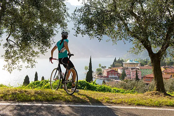 Woman with bicycle enjoying the view