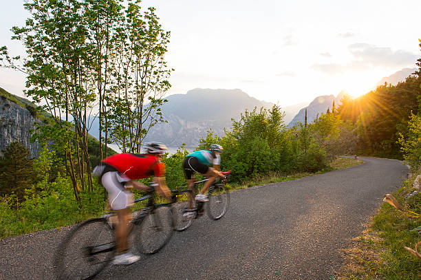 istock roadcycling with blurred motion to the sunset 506404354