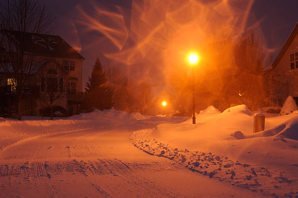 Community at night during a Winter Blizzard, Pennsylvania, USA; halos are due to the snow blew by strong wind.