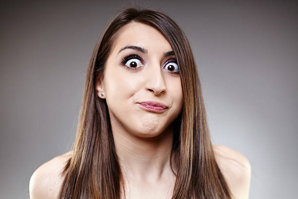 Girl making faces with glasses