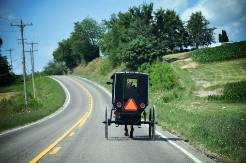 An Amish horse and carriage approaches the Eshelman's covered bridge in Lancaster County, Pennsylvania