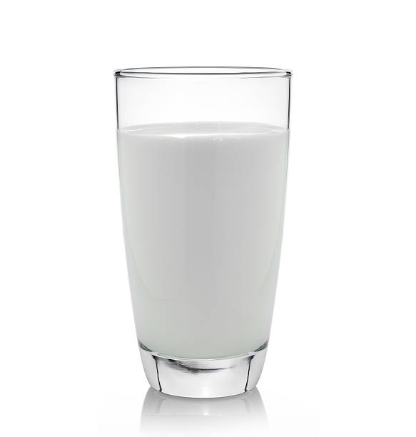 istock fresh milk in the glass on white background 506429157