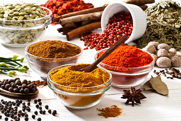 istock White table filled with exotic spices and herbs 506430351