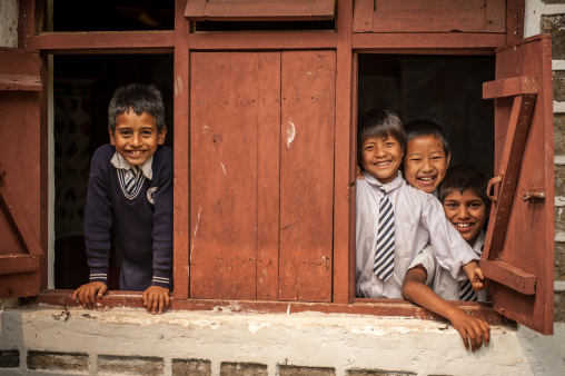 Pelling, India - April 15, 2013:The Indian students at the window in Pelling school in Pelling,India.