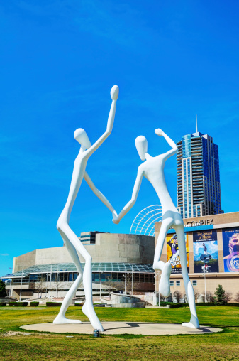 Denver, USA - April 30, 2014: The Dancers public sculpture in Denver, Colorado. The Dancers was permanently installed in front of the Denver Performing Arts Complex on June 12, 2003.