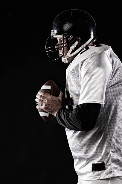 istock player profile gripping football 506433859