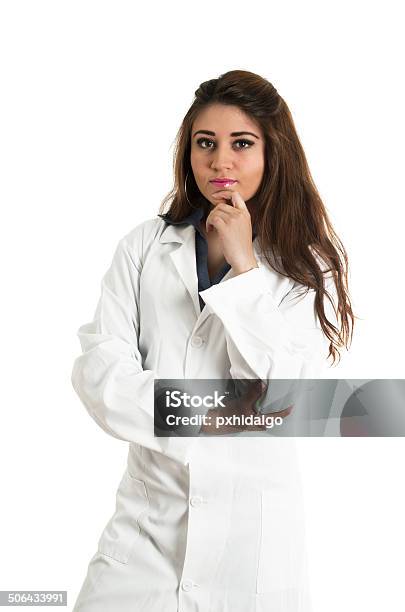 Young Beautiful Female Doctor Standing Stock Photo - Download Image Now - Adult, Backgrounds, Brown Hair