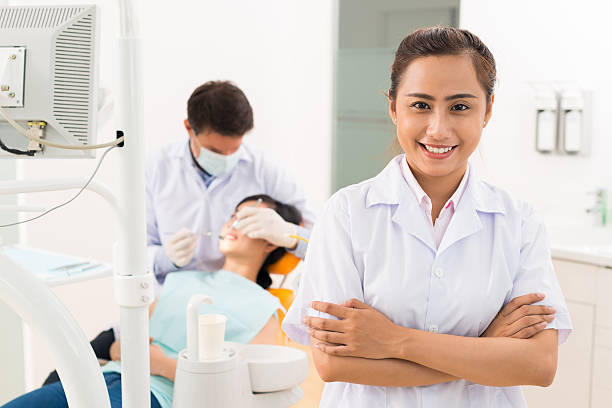 istock Cheerful assistant of dentist 506434141