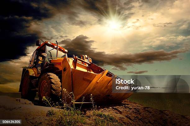 Yellow Tractor On Sky Background Stock Photo - Download Image Now - Machinery, Agriculture, Land