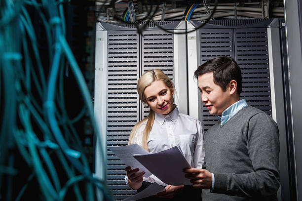istock Young engineers businessmen in server room 506434522