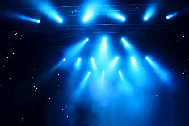 Photo of Bright rays of light on stage