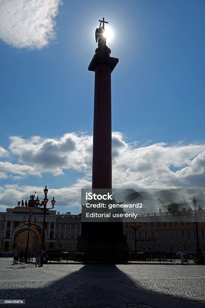 Alexander Column in Palace Square St. Petersburg, Russia.  August 26, 2013.  The sun backlights the angel on top of the Alexander Column in Palace Square. Angel Stock Photo