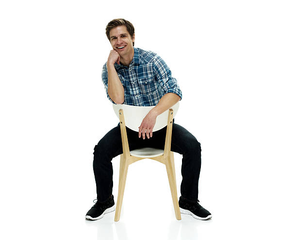 istock Casual man sitting on chair 506436528