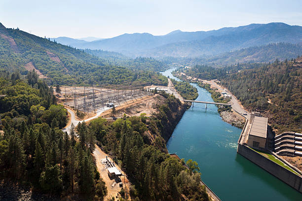 Shasta Lake Hydroelectric Power Plant Looking down at the spillway and hydro power plant from top of a Shasta Dam in California. mt shasta photos stock pictures, royalty-free photos & images
