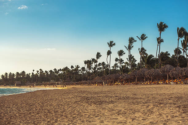 istock Carribean vacation, beautiful sunrise over tropical beach 506437098