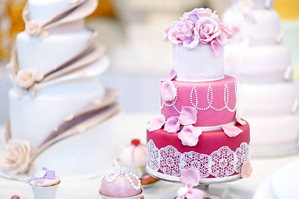 istock White wedding cake decorated with sugar flowers 506438538