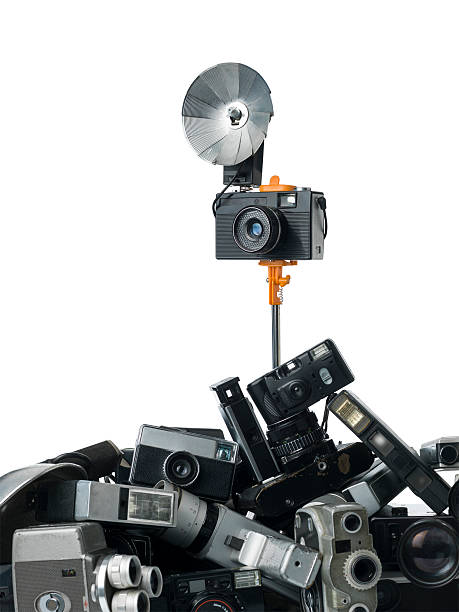 istock Retro Styled Camera Attached To Selfie Stick On White 506440280