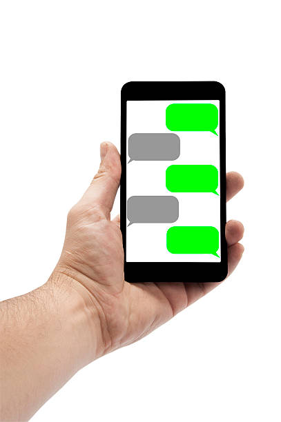 istock Hand Holding A Smart Phone With SMS Chat On Screen 506441436
