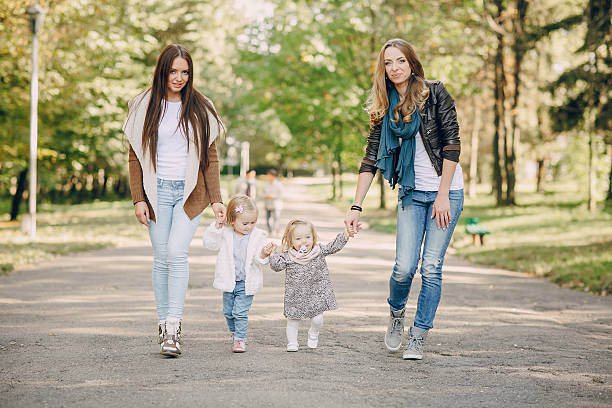 istock young family walking in the park 506441620