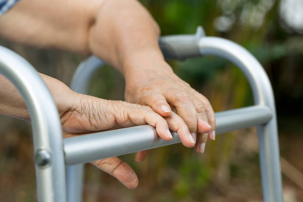 istock senior woman using a walker at home 506441696