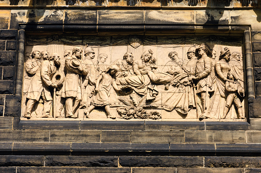 This international landmark, as seen on the external public-facing door of the baptistery, was designed by Lorenzo Ghiberti (between 1425-1452) and is an icon of the renaissance. The reliefs represent stories from the Old Testament. The visible heads are those of prophets. The doors displayed are now a copy of the original, with those being displayed in a local museum.