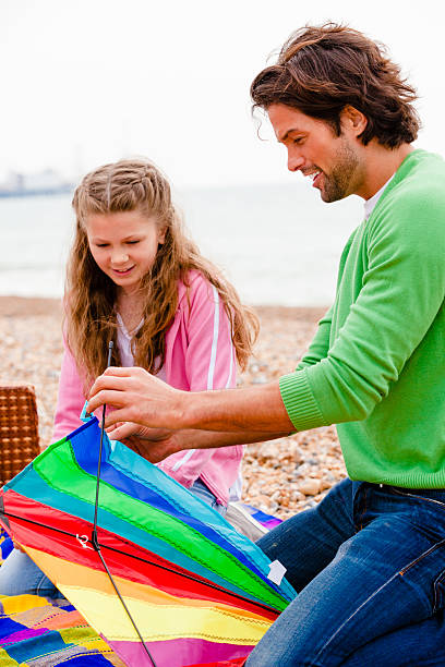 istock Father and Daughter with a Kite 506444246