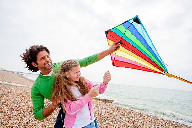 istock Father and Daughter with a Kite 506444412