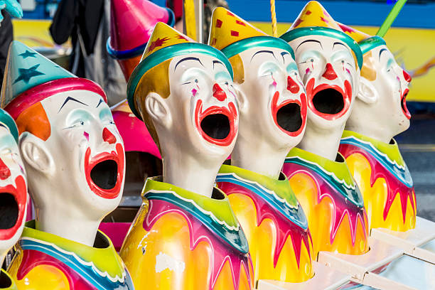 istock Clown Heads in a Row at Fun Fair 506444842