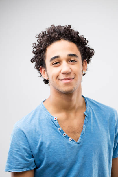istock smiling handsome young man with blue t-shirt 506446554