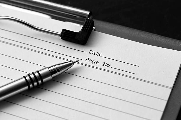 istock Close up of a note pad with pen 506448416