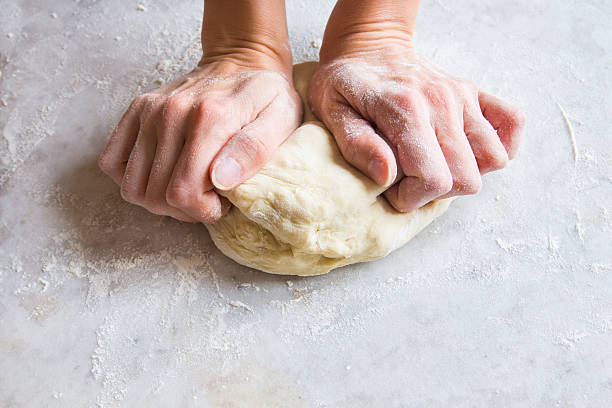 mãos amassar massa de pão - dough kneading human hand bread - fotografias e filmes do acervo