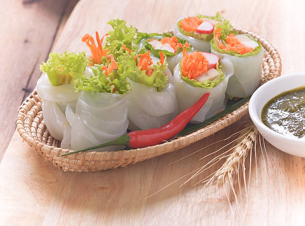 istock spring rolls with spicy sauce, vegetables and in noodle tube. 506467776