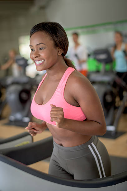 istock Black woman running on a treadmill 506467998
