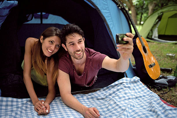 istock Friends take their own Selfie at camping 506468071