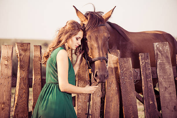 istock woman and horse 506468185