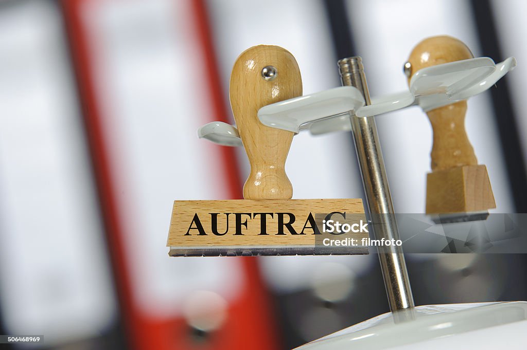 Order - in german: order Auftrag - in english: order - marked on rubber stamp in office Advertisement Stock Photo