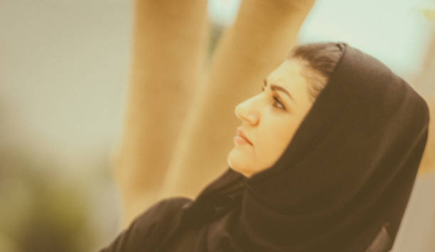 istock Arab Woman in a park 506470046