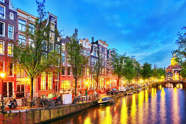 istock Westerkerk (Western Church), with water canal view in Amsterdam. 506470230