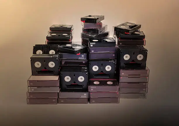 Photo of Abandoned pile of old useless mini DV