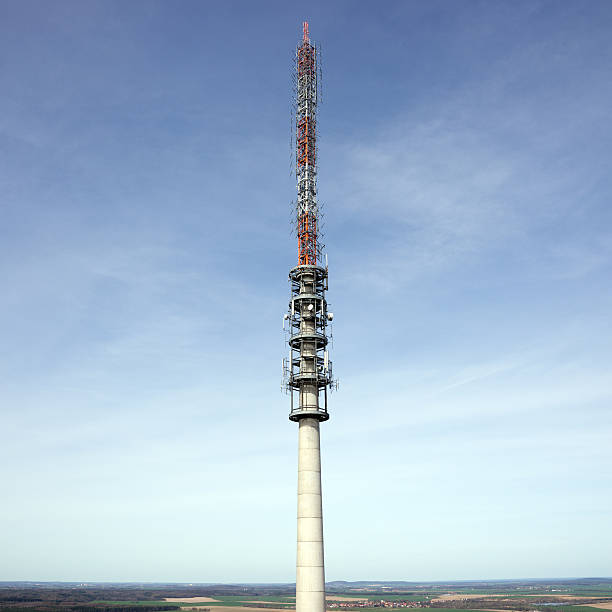istock Telecommunication antenna tower with the blue sky 506471204