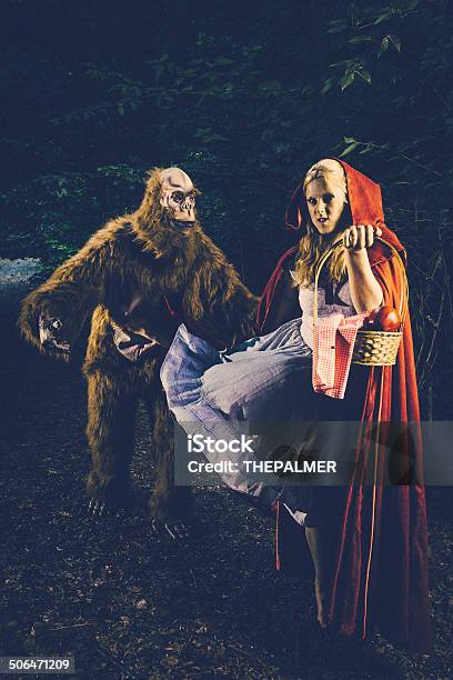 Little Red Riding Hood Kicking Bigfoot Stock Photo - Download Image Now - Adult, Animal, Animals Hunting