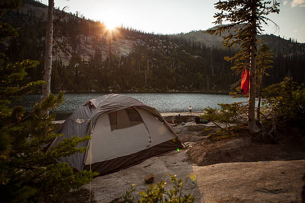 istock Campsite alongside alpine lake at sunset 506471473
